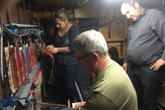 Alex and Kymm wiring, Tony supervises.